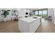 Modern kitchen island with white marble top at 1591 Gulf Of Mexico Dr # 515, Longboat Key, FL 34228