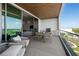 Spacious balcony with outdoor seating and ocean view at 1591 Gulf Of Mexico Dr # 515, Longboat Key, FL 34228