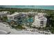 Aerial view of luxurious beachfront property with resort amenities at 1591 Gulf Of Mexico Dr # 515, Longboat Key, FL 34228