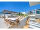Outdoor patio with grilling station and seating at 1591 Gulf Of Mexico Dr # 515, Longboat Key, FL 34228