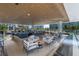 Outdoor bar with seating and ocean views at 1591 Gulf Of Mexico Dr # 515, Longboat Key, FL 34228