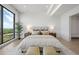 Spacious bedroom with large windows and water view at 1591 Gulf Of Mexico Dr # 515, Longboat Key, FL 34228