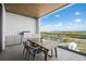 Private balcony with outdoor kitchen and ocean view at 1591 Gulf Of Mexico Dr # 515, Longboat Key, FL 34228