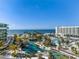 Drone view of resort amenities, including pools and beach access at 1591 Gulf Of Mexico Dr # 515, Longboat Key, FL 34228