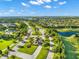 Aerial view of Del Webb Lakewood Ranch showing community layout, lakes, and entrance on a bright, sunny day at 17802 Eastbrook Ter, Lakewood Ranch, FL 34202