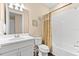Bright bathroom featuring a shower-tub combo and single sink vanity at 17802 Eastbrook Ter, Lakewood Ranch, FL 34202