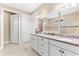 A spacious bathroom with double sinks, granite counters, a view of the shower at 17802 Eastbrook Ter, Lakewood Ranch, FL 34202
