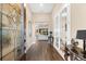 Elegant foyer with hardwood floors and decorative glass front door at 17802 Eastbrook Ter, Lakewood Ranch, FL 34202