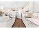 Bright kitchen boasts stainless appliances, ample counter space, hardwood floors, and modern lighting fixtures at 17802 Eastbrook Ter, Lakewood Ranch, FL 34202