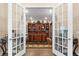 Executive office with custom built-in shelving and a large wooden desk at 17802 Eastbrook Ter, Lakewood Ranch, FL 34202