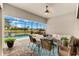 Relaxing screened lanai with brick flooring, stylish furniture, and a view of the pool and landscape at 17802 Eastbrook Ter, Lakewood Ranch, FL 34202