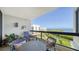 Relaxing balcony overlooking tranquil water views and lush landscape at 1930 Harbourside Dr # 145, Longboat Key, FL 34228