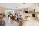 Bright living room with open floor plan and views of pool and kitchen at 2807 Coral Way, Punta Gorda, FL 33950