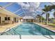 Inviting pool area with screened enclosure, perfect for relaxation and outdoor enjoyment at 2807 Coral Way, Punta Gorda, FL 33950