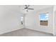 Bright bedroom with gray carpet, ceiling fan and window with a view at 4704 Foxtail Dr, Parrish, FL 34219