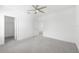 Bright bedroom with ceiling fan and walk-in closet at 4704 Foxtail Dr, Parrish, FL 34219