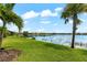 Lakefront backyard with lush landscaping at 4704 Foxtail Dr, Parrish, FL 34219