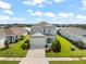 Two-story home with a two-car garage and landscaped lawn at 4704 Foxtail Dr, Parrish, FL 34219