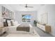 Spacious bedroom with water views, neutral decor, and ample natural light at 4704 Foxtail Dr, Parrish, FL 34219