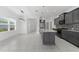 Modern kitchen with granite countertops, gray cabinets, and tile flooring at 4704 Foxtail Dr, Parrish, FL 34219