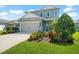 Two-story house with a two-car garage and well-manicured lawn at 4704 Foxtail Dr, Parrish, FL 34219