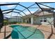 Screened pool and patio with lake view at 4704 Foxtail Dr, Parrish, FL 34219