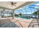 Screened pool and patio area with lake view at 4704 Foxtail Dr, Parrish, FL 34219