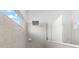 Large walk-in shower with neutral tile and a rainfall shower head at 4704 Foxtail Dr, Parrish, FL 34219