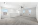 Large bonus room featuring carpet, windows, and a ceiling fan at 4704 Foxtail Dr, Parrish, FL 34219