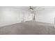 Spacious bonus room with carpet and multiple doors at 4704 Foxtail Dr, Parrish, FL 34219