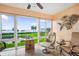 Sunroom boasting stunning water views, comfortable furniture, and a relaxing atmosphere at 4737 Independence Dr # 4737, Bradenton, FL 34210