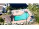 Community pool with hot tub and lounge chairs at 508 Woodstork Cir, Bradenton, FL 34209