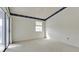 Bright bedroom with patio access and ceiling fan at 508 Woodstork Cir, Bradenton, FL 34209