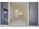 Spacious living room with sliding doors to a deck and water view at 508 Woodstork Cir, Bradenton, FL 34209