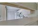 Kitchen with white cabinets, appliances and breakfast bar at 508 Woodstork Cir, Bradenton, FL 34209