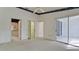 Spacious bedroom with access to a private patio and bathroom at 508 Woodstork Cir, Bradenton, FL 34209