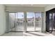 Living room with sliding doors leading to a deck and water view at 508 Woodstork Cir, Bradenton, FL 34209