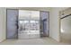 Bedroom with sliding doors to a private deck and water view at 508 Woodstork Cir, Bradenton, FL 34209