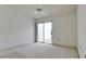 Simple bedroom with patio access and ceiling fan at 508 Woodstork Cir, Bradenton, FL 34209