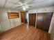 Bedroom with wood-look flooring and double closets at 5413 Colleen Dr, Bradenton, FL 34207