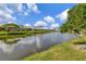 Community canal-front view with lush landscaping and beautiful homes at 5456 Kelly Dr # 10, Sarasota, FL 34233