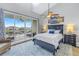 Bright main bedroom with water views and a ceiling fan at 551 Bahia Beach Blvd, Ruskin, FL 33570