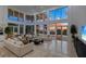 Living area with expansive ocean views at sunset at 5919 Gulf Of Mexico Dr, Longboat Key, FL 34228