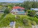 Beachfront property with lush landscaping and pool at 5919 Gulf Of Mexico Dr, Longboat Key, FL 34228