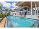 Stunning infinity pool with ocean views and spacious patio area at 5919 Gulf Of Mexico Dr, Longboat Key, FL 34228