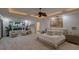 Main bedroom with ocean views, sitting area and ceiling fan at 5919 Gulf Of Mexico Dr, Longboat Key, FL 34228