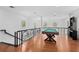 Game room with pool table and hardwood floors at 5919 Gulf Of Mexico Dr, Longboat Key, FL 34228
