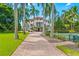 Home with tennis court and palm trees at 5919 Gulf Of Mexico Dr, Longboat Key, FL 34228