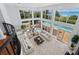 Expansive living room with high ceilings, ocean views, and tiled floors at 5919 Gulf Of Mexico Dr, Longboat Key, FL 34228