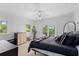 Spacious bedroom with a king-size bed and sliding glass doors to balcony at 5919 Gulf Of Mexico Dr, Longboat Key, FL 34228